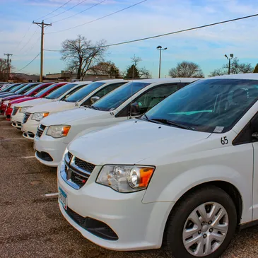 White ITC Transit vans parked in a row